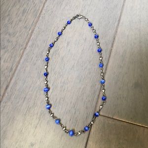 Blue bead & silver-tone necklace. 16 inches long.